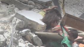 a-five-year-old-girl-s-desperate-attempt-to-save-her-baby-sister-from-falling-down-a-bomb-hit-building-in-syria