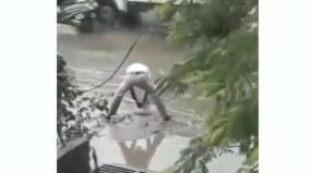 karnataka-cop-cleans-waterlogged-road-in-viral-video