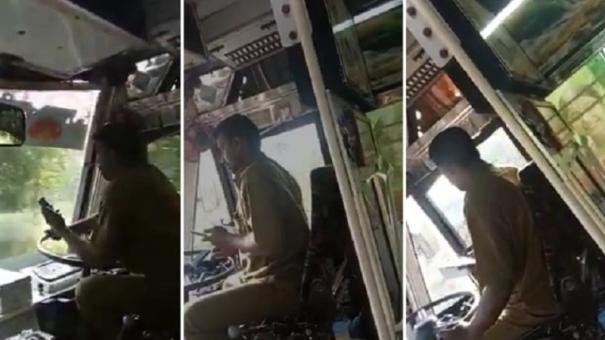 Driver drives bus watching cellphone