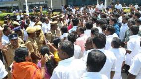 admk-banner-damaged-in-airport-ruckus-by-cadres