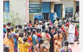 people-gather-at-the-ration-shop