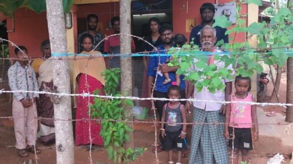 the-villagers-of-pootai-locked-the-family-who-refused-to-move-on-the-patta-land-near-sankarapuram-by-setting-up-a-barbed-wire-fence