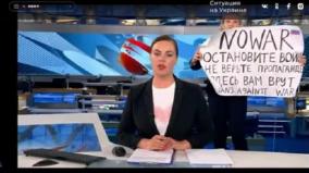 a-russian-journalist-just-stormed-a-live-broadcast-to-protest-the-war-they-are-lying-to-you