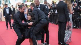 activist-removed-from-cannes-red-carpet-following-naked-protest-against-sexual-violence-in-ukraine