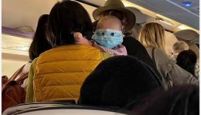 viral-photo-shows-baby-in-full-face-mask-on-new-zealand-flight