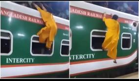 overcrowded-train-bangladesh-woman-tries-to-climb-roof-to-travel-viral-video