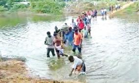 due-to-the-lack-of-road-facilities-near-puducherry-the-dead-body-has-to-be-taken-down-the-river