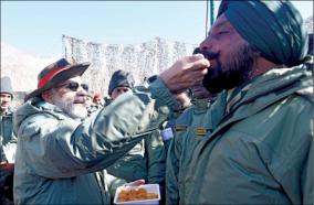 modi-celebrates-diwali-with-army-soldiers-from-prime-minister-kargil-feeds-army-soldiers-with-sweets