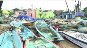 fear-of-storm-puducherry-fishermen-who-parked-their-boats-on-the-streets-near-their-homes-and-secured-them