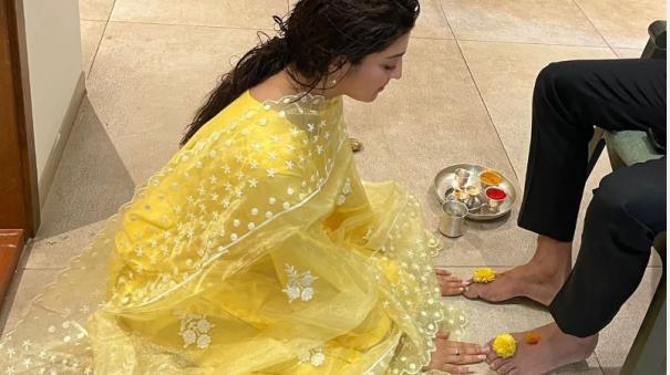 Pranitha Subhash touches husband feet on Bheemana Amavasya