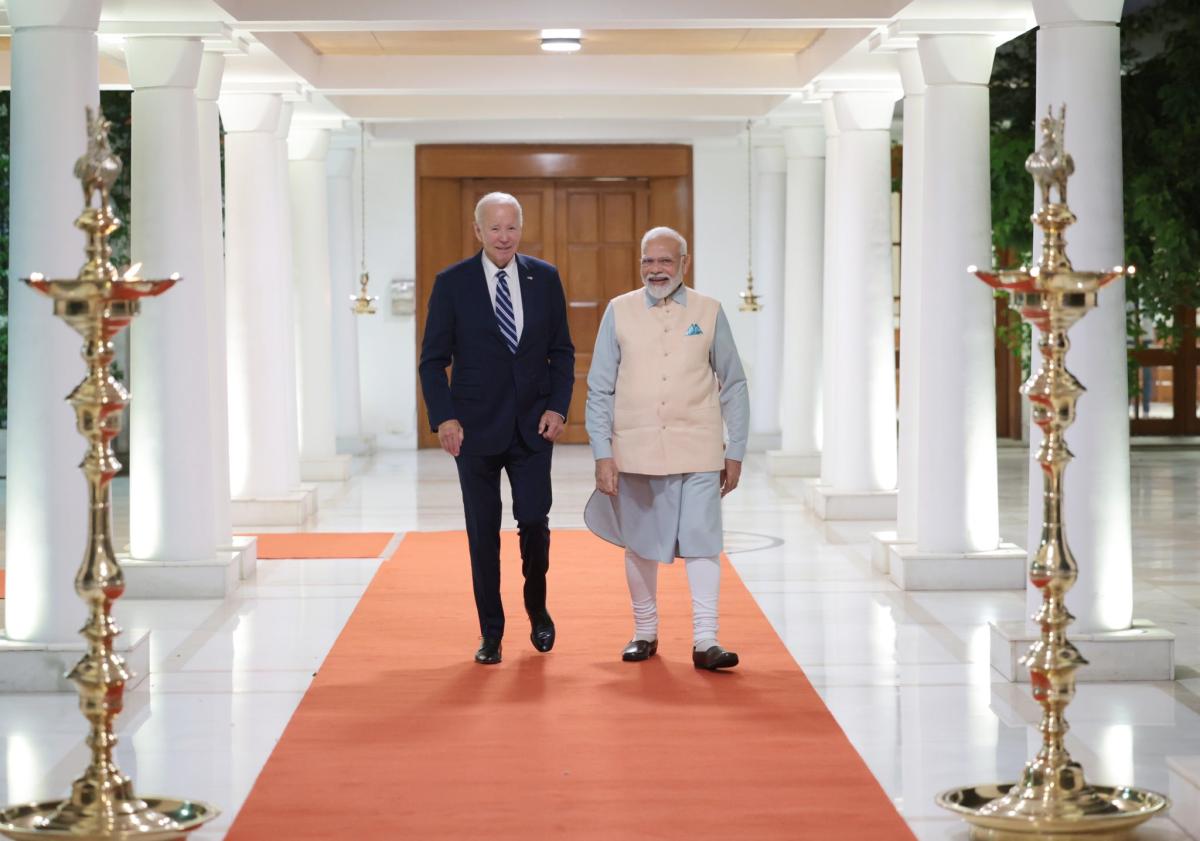 US President Joe Biden talks with Prime Minister Narendra Modi