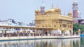 the-golden-temple-of-amritsar-shines-in-the-middle-of-the-pond
