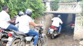 motorists-bend-their-heads-and-drive-in-permbur-subway