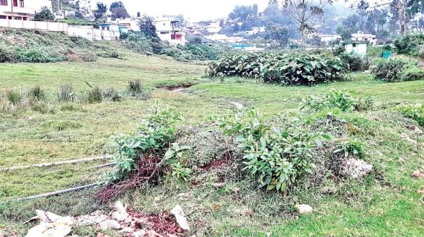 Swamp land polluted by construction waste in Kotagiri