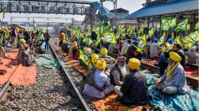 farmers-strike-by-sitting-on-tracks-in-punjab-trains-diverted-by-protest