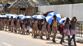 students-going-to-school-with-umbrellas-in-madurai