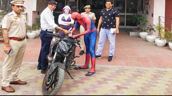 bike stunt on road delhi police nets spiderman couple