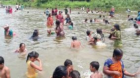 people-enjoy-bathing-on-veerapandi-check-dam-to-overcome-the-effects-of-the-sun