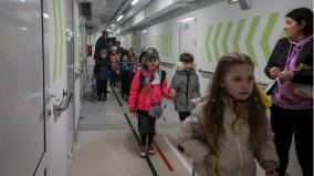 kids-attend-ukraine-s-first-bunker-school-down-concrete-staircase-crossing-two-doors