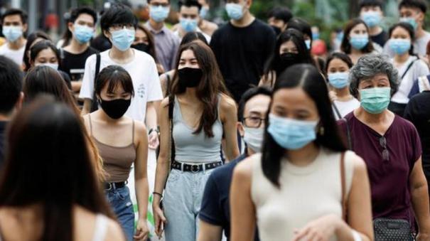 Singapore seeing new Covid-19 wave minister advises wearing of masks