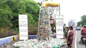a-sculpture-of-plastic-waste-pouring-out-of-a-water-pipe-environmental-awareness-at-yercaud