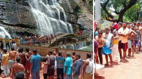 a-long-queue-to-bathe-in-the-waterfall-is-crowded-with-tourists-at-courtallam