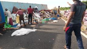 a-lorry-loaded-with-soft-drinks-overturned-on-the-national-highway-near-ettayapuram