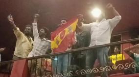 vijay-fans-throng-theatres-with-tvk-flags