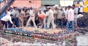 andhra-locals-seize-alcohol-bottles-meant-to-be-destroyed-by-bulldozer