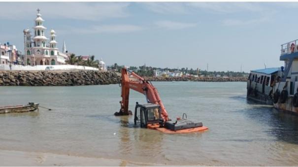 JCB vehicle buried in sand while dredging Kanyakumari boathouse