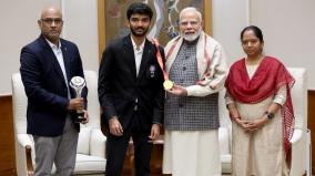 pm-narendra-modi-meets-d-gukesh-and-receives-signed-chess-board-from-world-champion