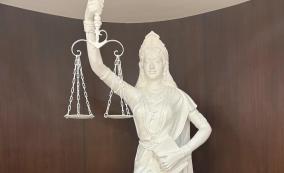 row-over-lady-justice-statue-in-sc