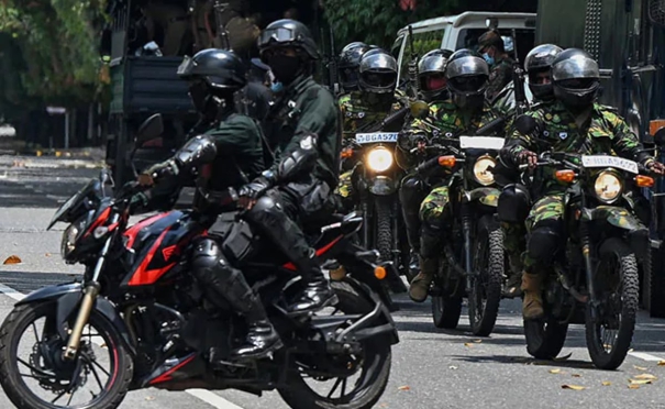 masked-soldiers-with-rifles-drove-through-the-crowd-in-sri-lanka