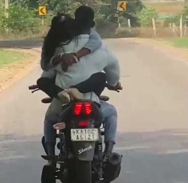 romantic-couple-on-a-running-bike-misbehaving-vibrant-motorists