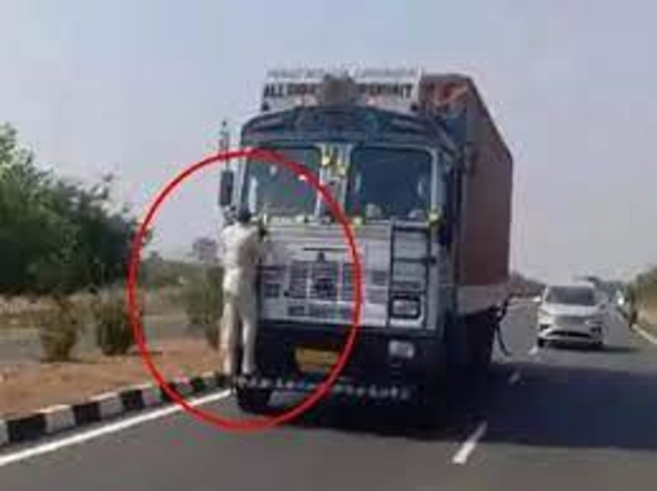 toll-gate-employee-holding-a-10km-truck-bumper-and-traveling