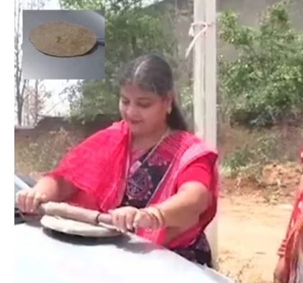 woman-cooking-chapati-on-car-panet