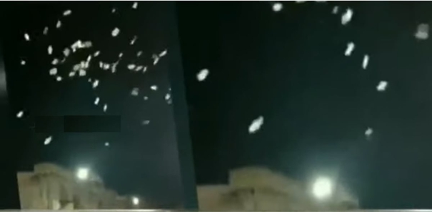 man-throws-rs-500-notes-in-the-air-at-hyderabads-charminar