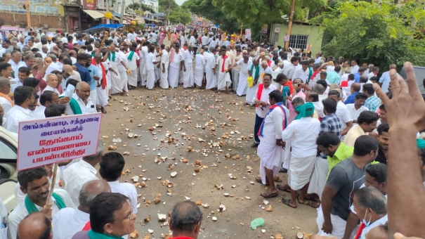 farmers-struggle-to-break-coconuts