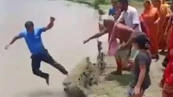 a-video-of-a-live-news-reporter-falling-into-a-river-in-assam-has-gone-viral